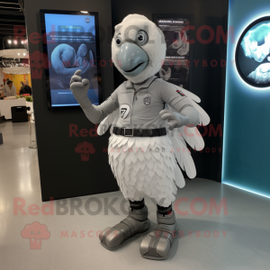Silver Turkey mascot costume character dressed with a Bodysuit and Smartwatches