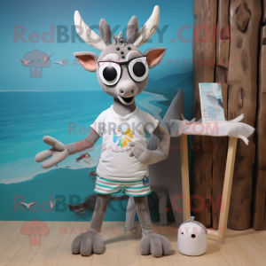 Silver Deer mascot costume character dressed with a Board Shorts and Brooches