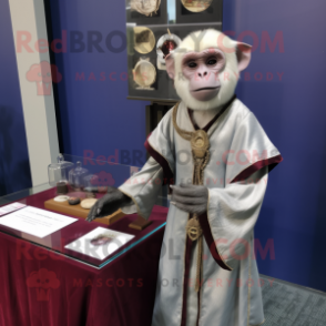 Silver Capuchin Monkey mascot costume character dressed with a Wrap Dress and Lapel pins