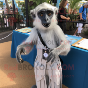 Silver Capuchin Monkey mascot costume character dressed with a Wrap Dress and Lapel pins