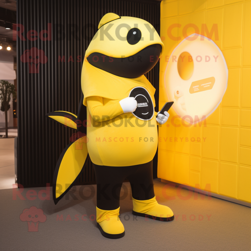 Yellow Killer Whale mascot costume character dressed with a Bodysuit and Wallets