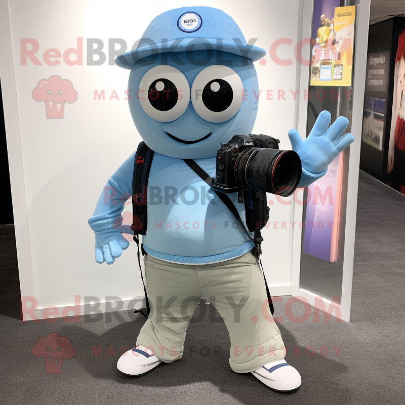 Sky Blue Camera mascot costume character dressed with a Oxford Shirt and Backpacks