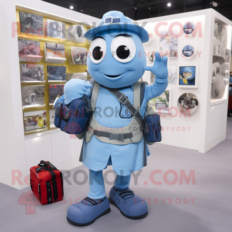 Sky Blue Camera mascot costume character dressed with a Oxford Shirt and Backpacks Sky Blue Camera mascot costume character dressed with a Oxford Shirt and Backpacks