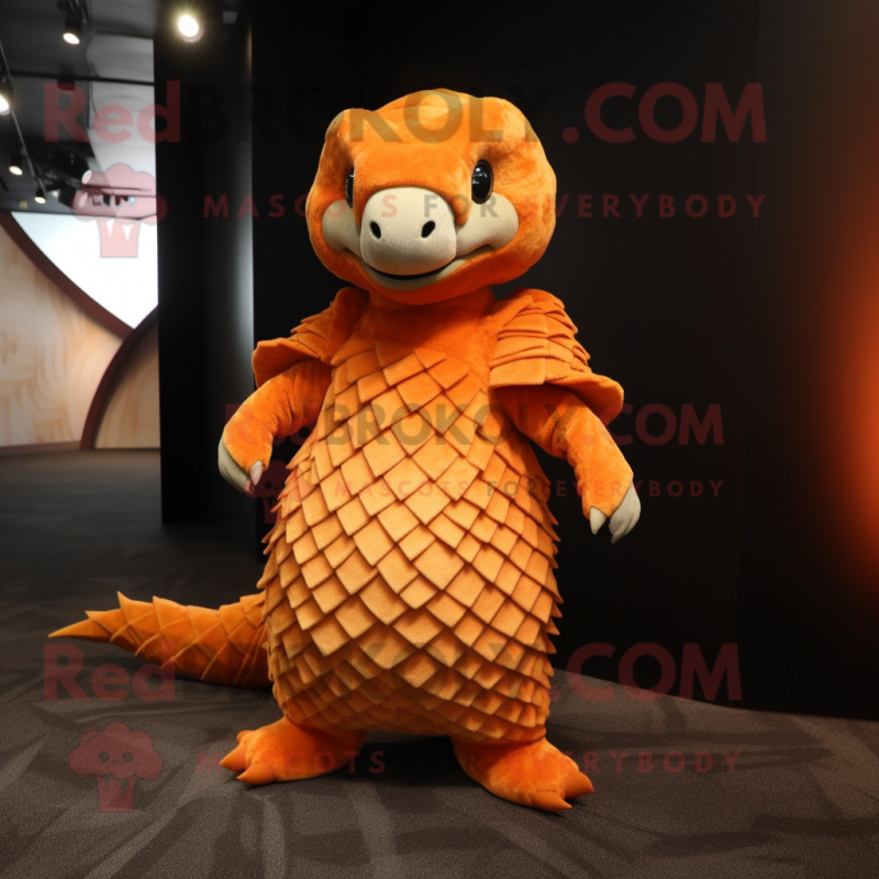 Orange Pangolin mascot costume character dressed with a Evening Gown and Suspenders Orange Pangolin mascot costume character dressed with a Evening Gown and Suspenders