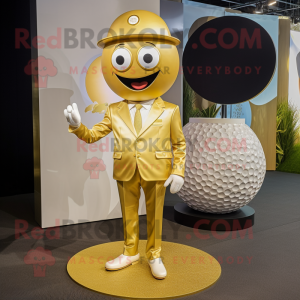 Gold Golf Ball mascot costume character dressed with a Romper and Lapel pins