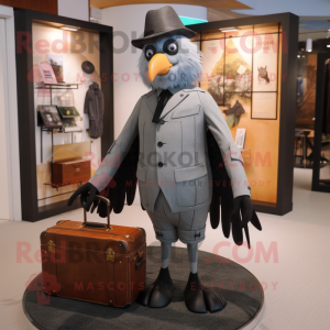 Gray Crow mascot costume character dressed with a Dress Pants and Briefcases