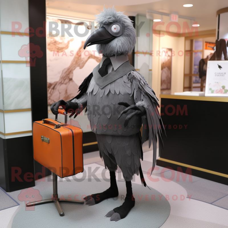 Gray Crow mascot costume character dressed with a Dress Pants and Briefcases