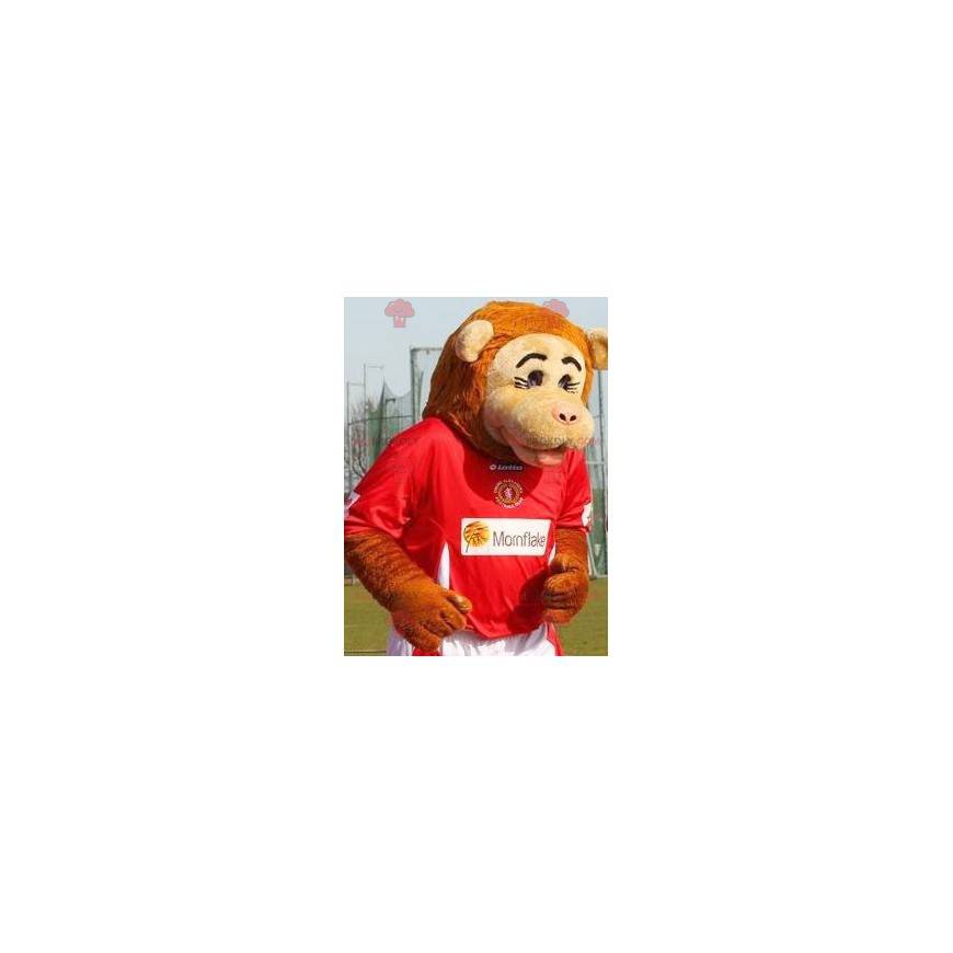 Mascote macaco bege e laranja em roupas esportivas -