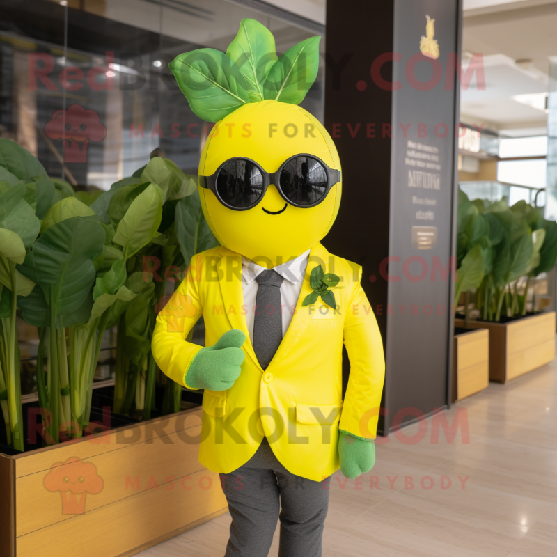 Yellow Spinach mascot costume character dressed with a Suit and Sunglasses