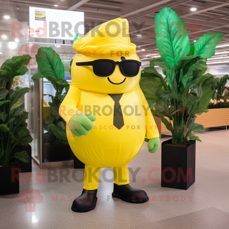 Yellow Spinach mascot costume character dressed with a Suit and Sunglasses Yellow Spinach mascot costume character dressed with a Suit and Sunglasses