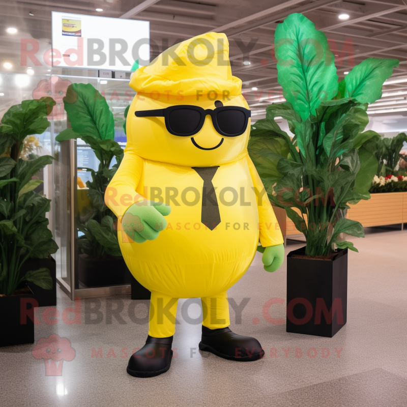 Yellow Spinach mascot costume character dressed with a Suit and Sunglasses