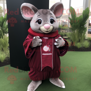 Maroon Chinchilla mascot costume character dressed with a Cardigan and Rings