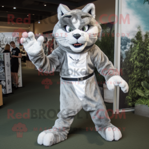 Silver Bobcat mascot costume character dressed with a Tank Top and Wraps