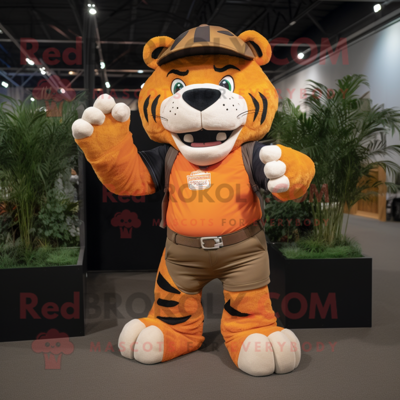 Orange Saber-Toothed Tiger mascot costume character dressed with a Cargo Pants and Gloves