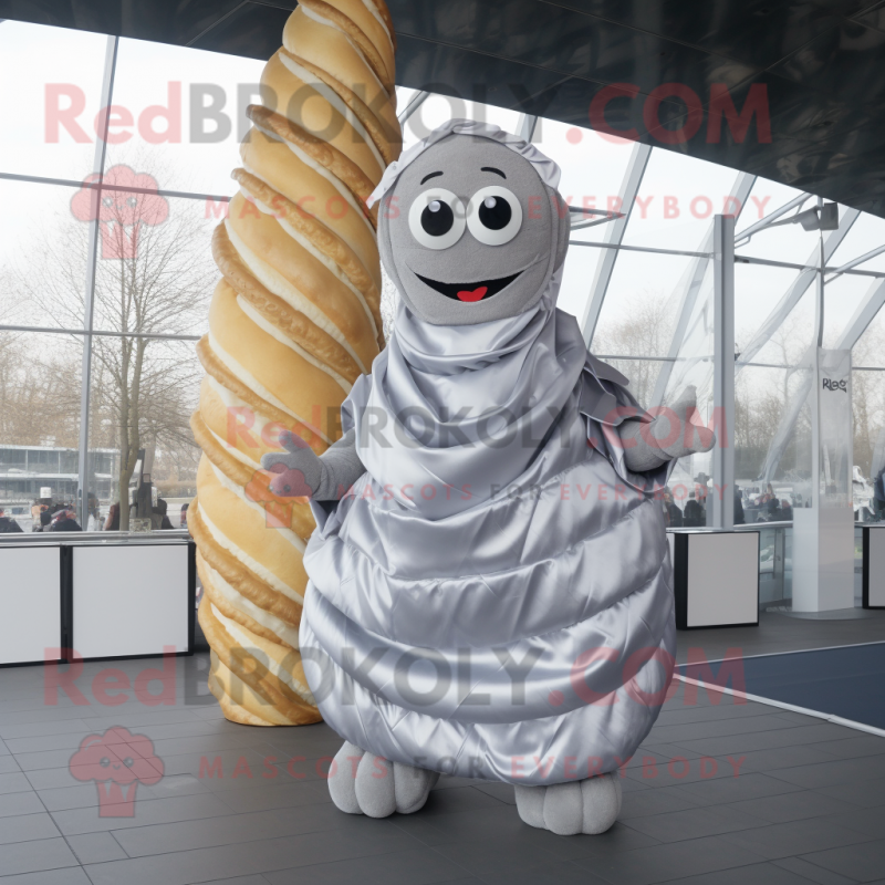 Silver Croissant mascot costume character dressed with a A-Line Skirt and Scarves