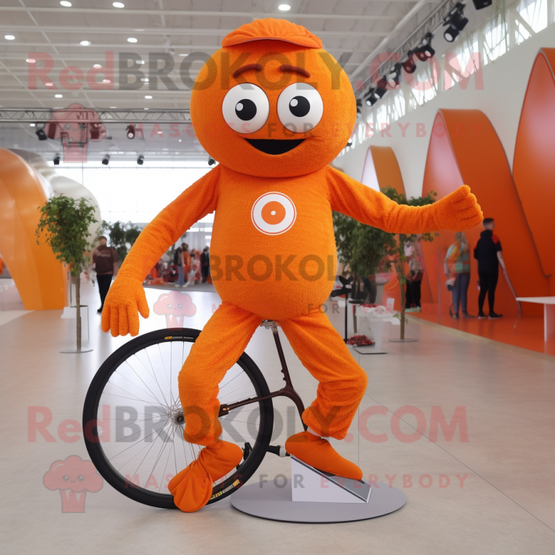 Orange Unicyclist mascot costume character dressed with a Running Shorts and Gloves