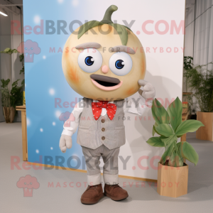 Beige Tomato mascot costume character dressed with a Chambray Shirt and Bow ties