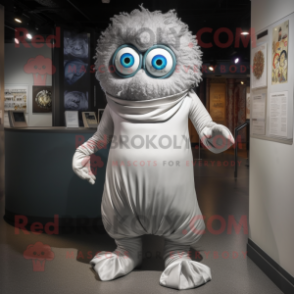 Silver Cyclops mascot costume character dressed with a Wrap Dress and Shoe laces