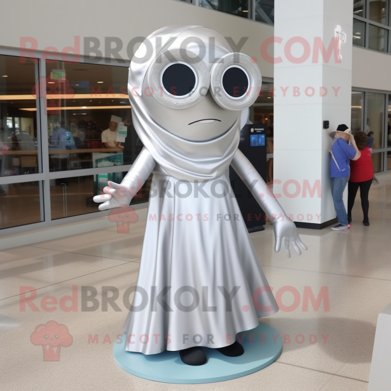 Silver Cyclops mascot costume character dressed with a Wrap Dress and Shoe laces Silver Cyclops mascot costume character dressed with a Wrap Dress and Shoe laces