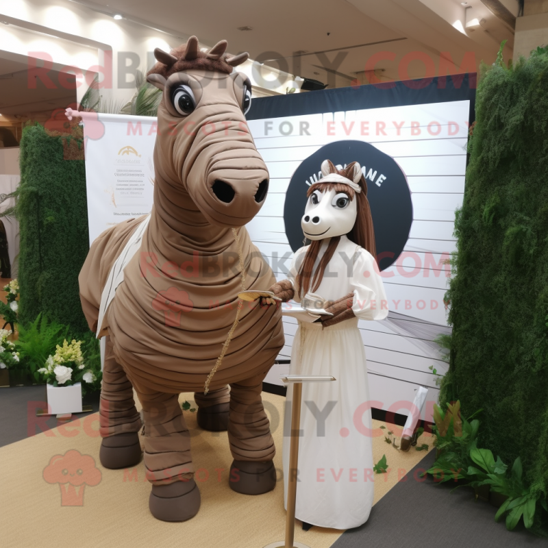 Brown Quagga mascot costume character dressed with a Wedding Dress and Messenger bags