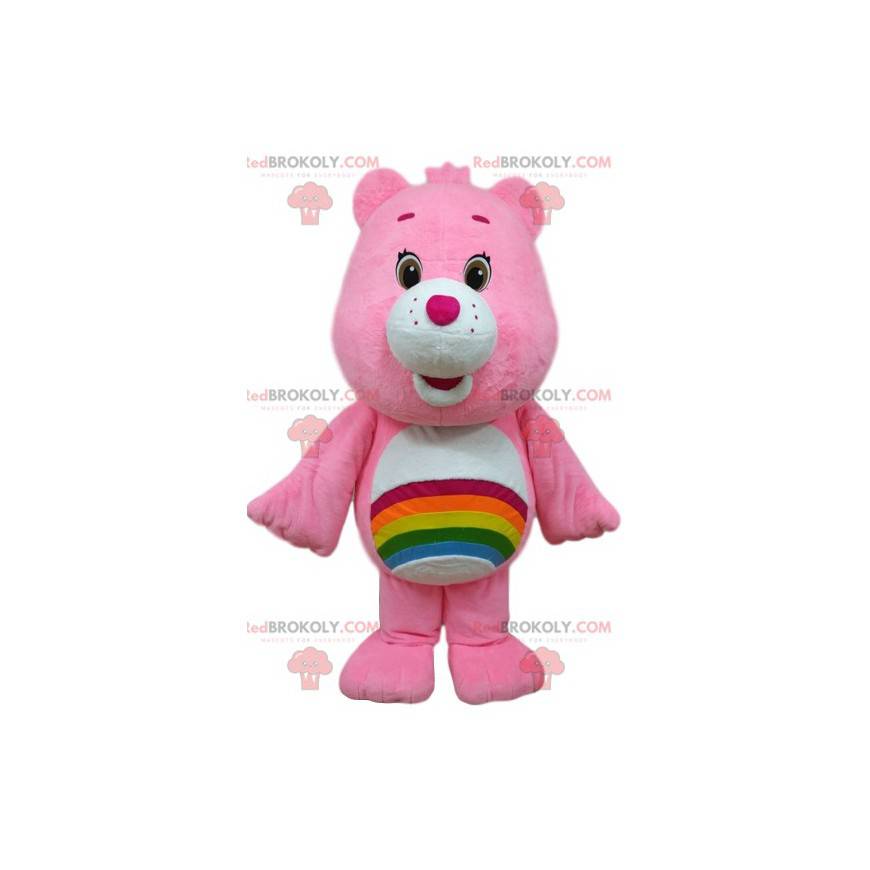 Mascota de oso de cuidado rosa con un arco iris en el estómago.