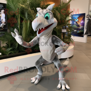 Silver Pterodactyl mascot costume character dressed with a Running Shorts and Backpacks