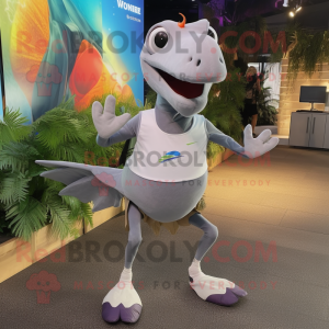 Silver Pterodactyl mascot costume character dressed with a Running Shorts and Backpacks