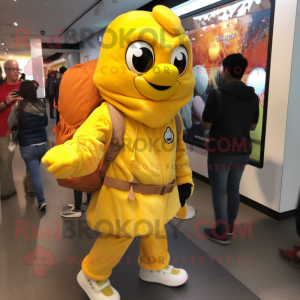 Yellow Butter Chicken mascot costume character dressed with a Jacket and Backpacks