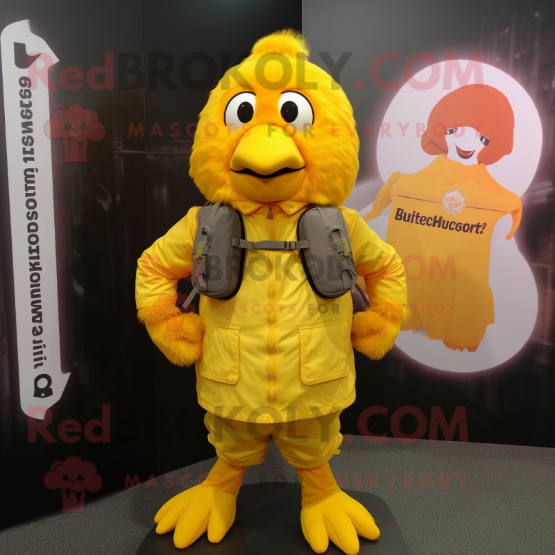 Yellow Butter Chicken mascot costume character dressed with a Jacket and Backpacks Yellow Butter Chicken mascot costume character dressed with a Jacket and Backpacks