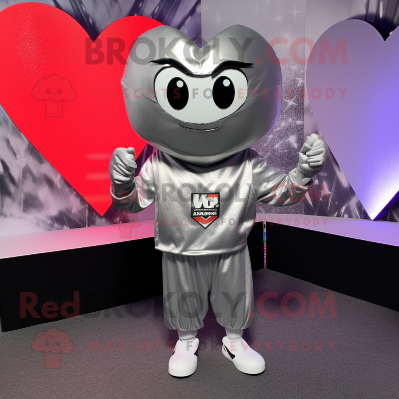 Silver Heart mascot costume character dressed with a Hoodie and Tie pins Silver Heart mascot costume character dressed with a Hoodie and Tie pins
