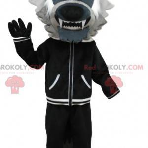 Graues Wolfsmaskottchen mit einer schwarzen Jacke. Wolfskostüm