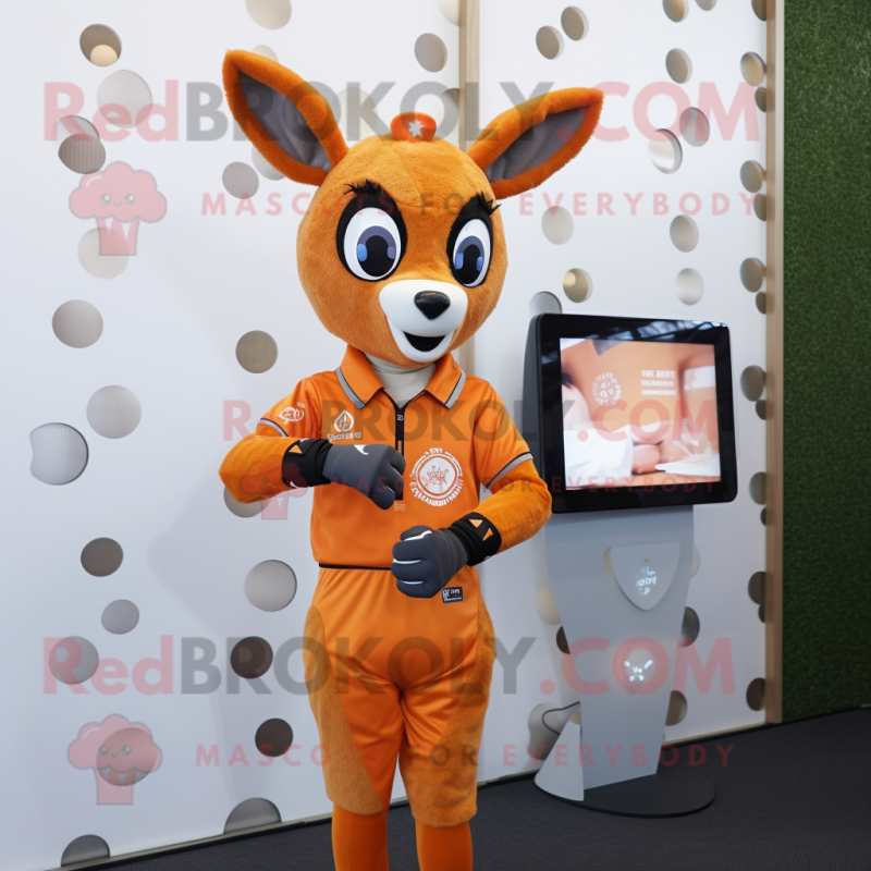 Orange Roe Deer mascot costume character dressed with a Oxford Shirt and Smartwatches Orange Roe Deer mascot costume character dressed with a Oxford Shirt and Smartwatches