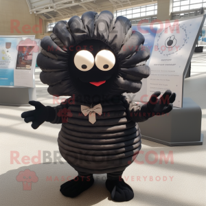 Black Trilobite mascot costume character dressed with a Dress and Bow ties