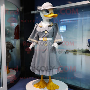 Silver Duck mascot costume character dressed with a A-Line Dress and Berets