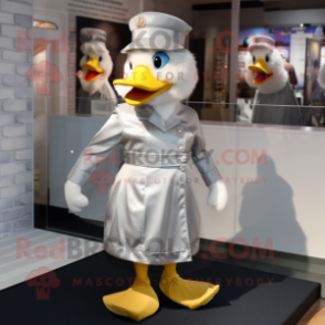 Silver Duck mascot costume character dressed with a A-Line Dress and Berets