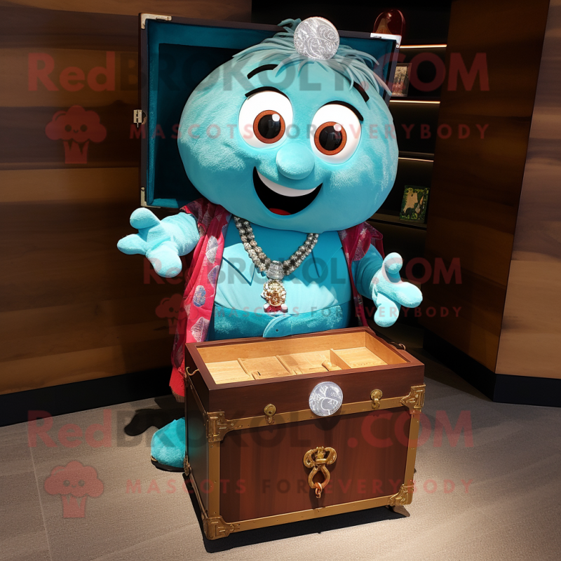 Turquoise Treasure Chest mascot costume character dressed with a Chambray Shirt and Brooches Turquoise Treasure Chest mascot costume character dressed with a Chambray Shirt and Brooches