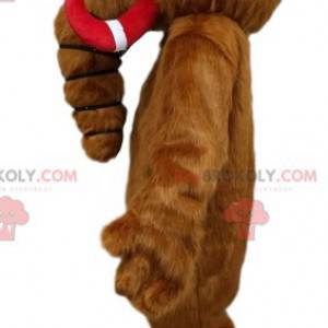 Mascotte mammut marrone con le sue zanne rosse e blu. -