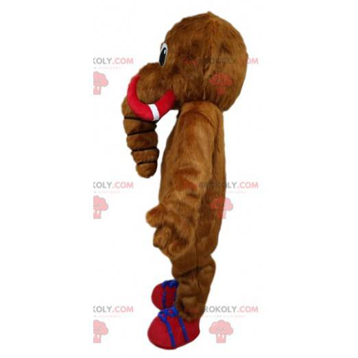 Mascotte mammut marrone con le sue zanne rosse e blu. -