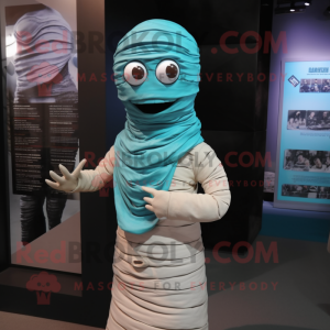 Cyan Mummy mascot costume character dressed with a Jacket and Scarves