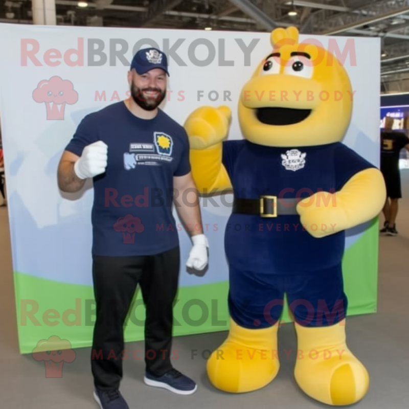 Navy Boxing Glove mascot costume character dressed with a Overalls and Watches Navy Boxing Glove mascot costume character dressed with a Overalls and Watches