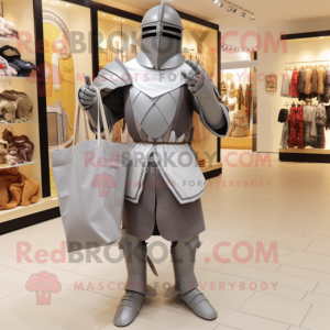 Gray Medieval Knight mascot costume character dressed with a Bodysuit and Tote bags