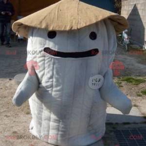 Mascot in the form of a giant and smiling white and brown hut -
