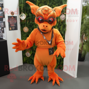 Orange Gargoyle mascot costume character dressed with a Playsuit and Keychains