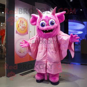 Pink Demon mascot costume character dressed with a Raincoat and Brooches