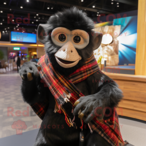 Black Capuchin Monkey mascot costume character dressed with a Flannel Shirt and Shawls