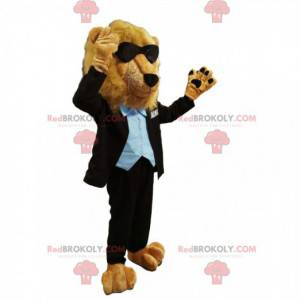 Mascotte de lion en costume noir, avec des lunettes de soleil -