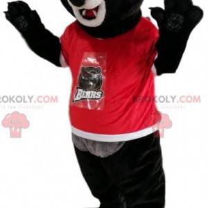 Mascote do urso preto com uma camisa vermelha. Fantasia de urso
