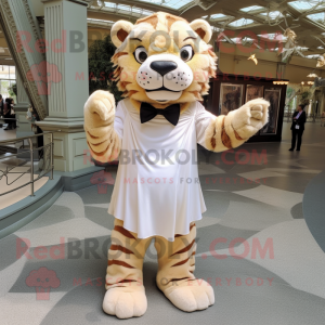 Beige Saber-Toothed Tiger mascot costume character dressed with a Empire Waist Dress and Bow ties