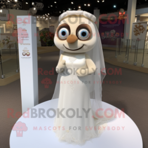 Beige Alliance mascot costume character dressed with a Wedding Dress and Rings
