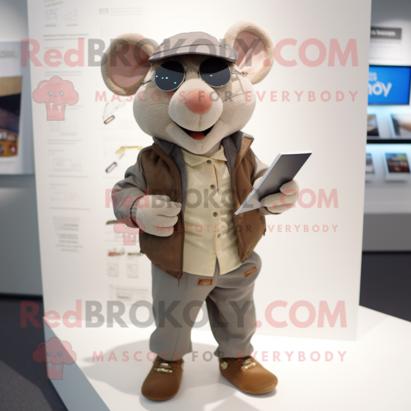 Beige Ray mascot costume character dressed with a Bomber Jacket and Reading glasses